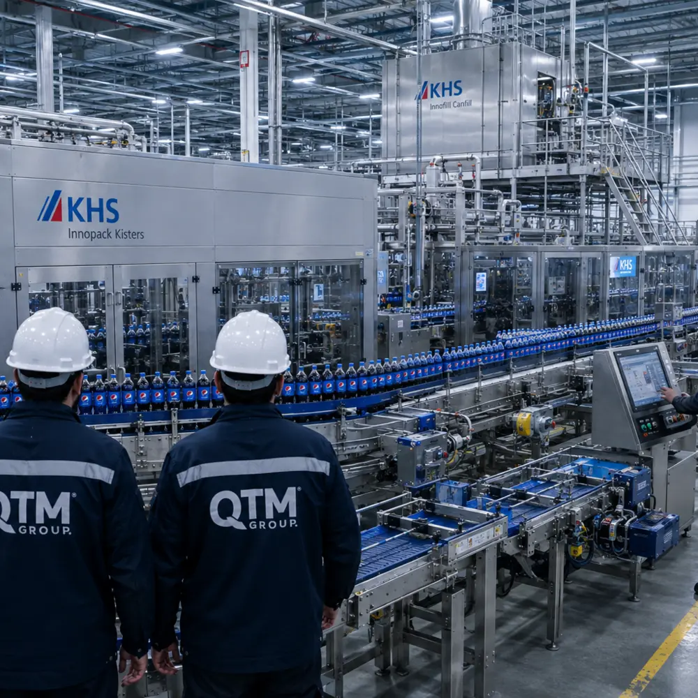 QTM Group team at a KHS beverage production line